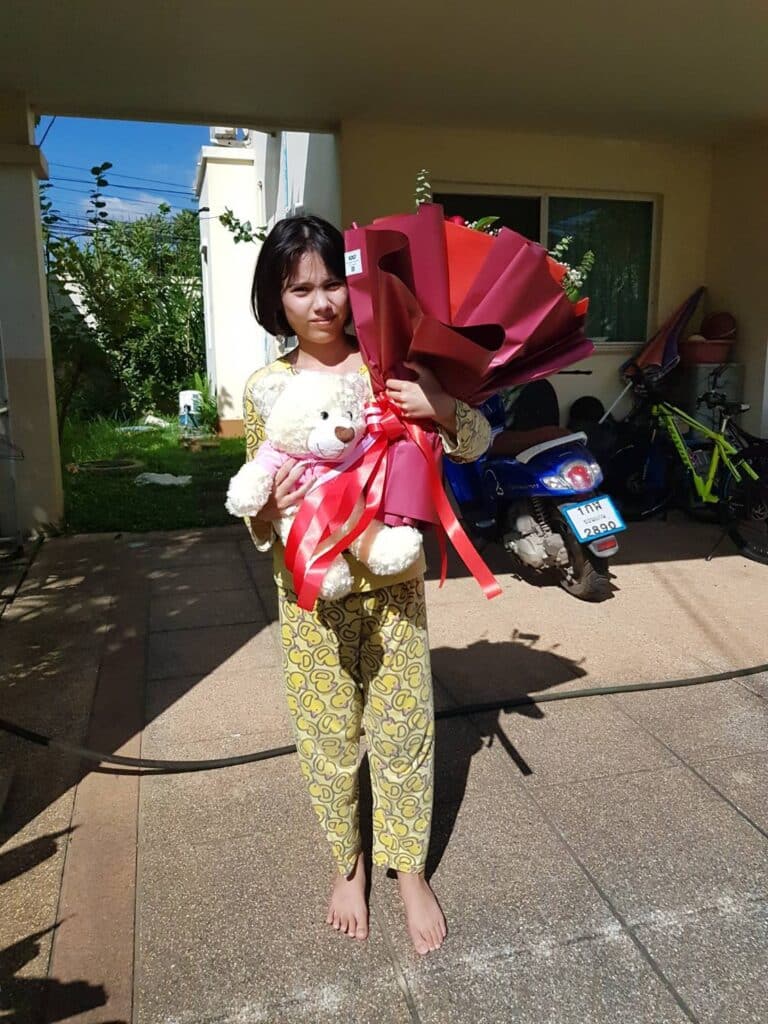 Photo of lady with flowers in Bangkok, Thailand
