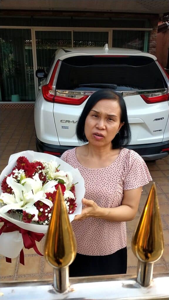 Photo of lady with flowers in Pathum Thani, Thailand