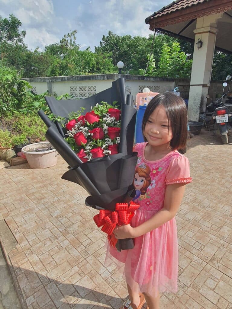 Photo of lady with flowers in Kanchanaburi, Thailand